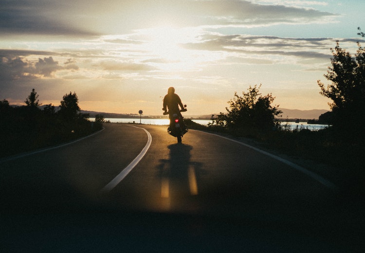 riding motorcycle during sunset